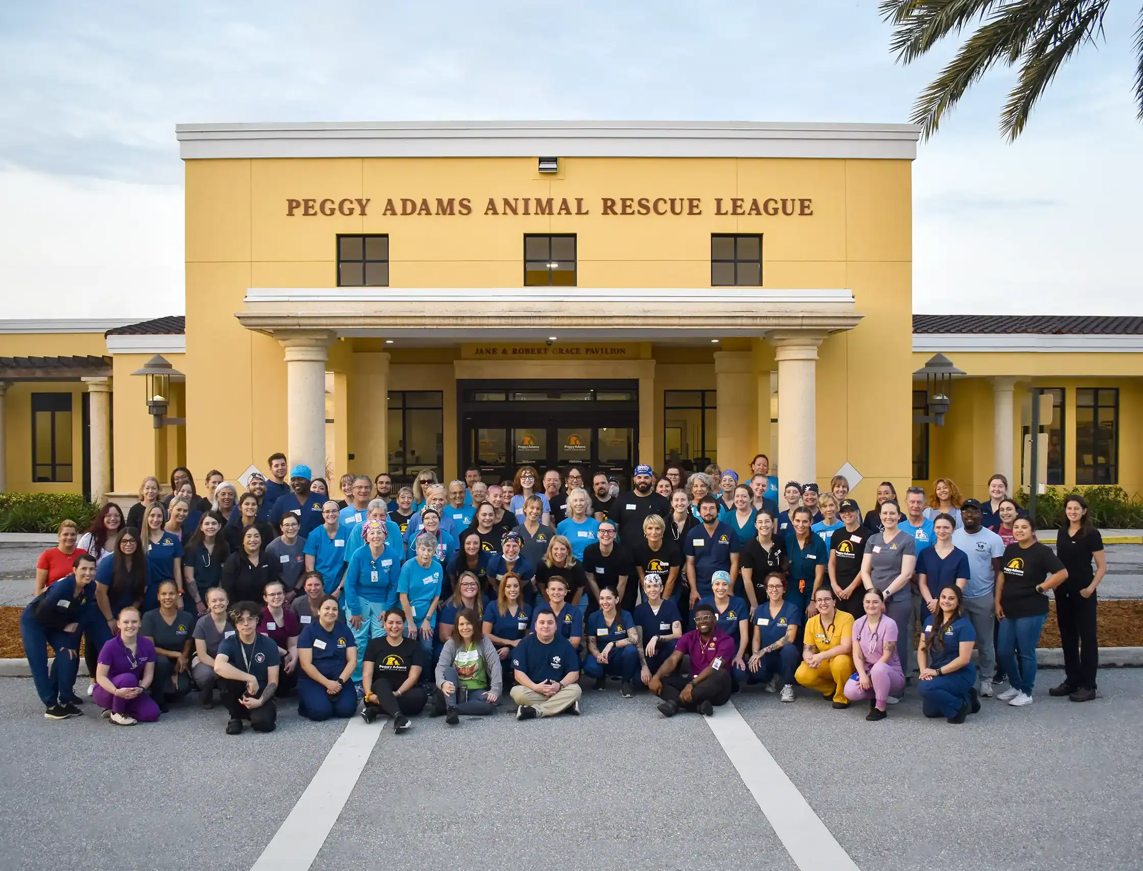 Staff and volunteers gathered outside Peggy Adams Animal Rescue League for a group photo.