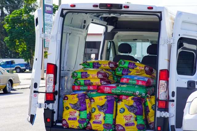 Pet food bags loaded in a delivery van for Peggy Adams Animal Rescue.