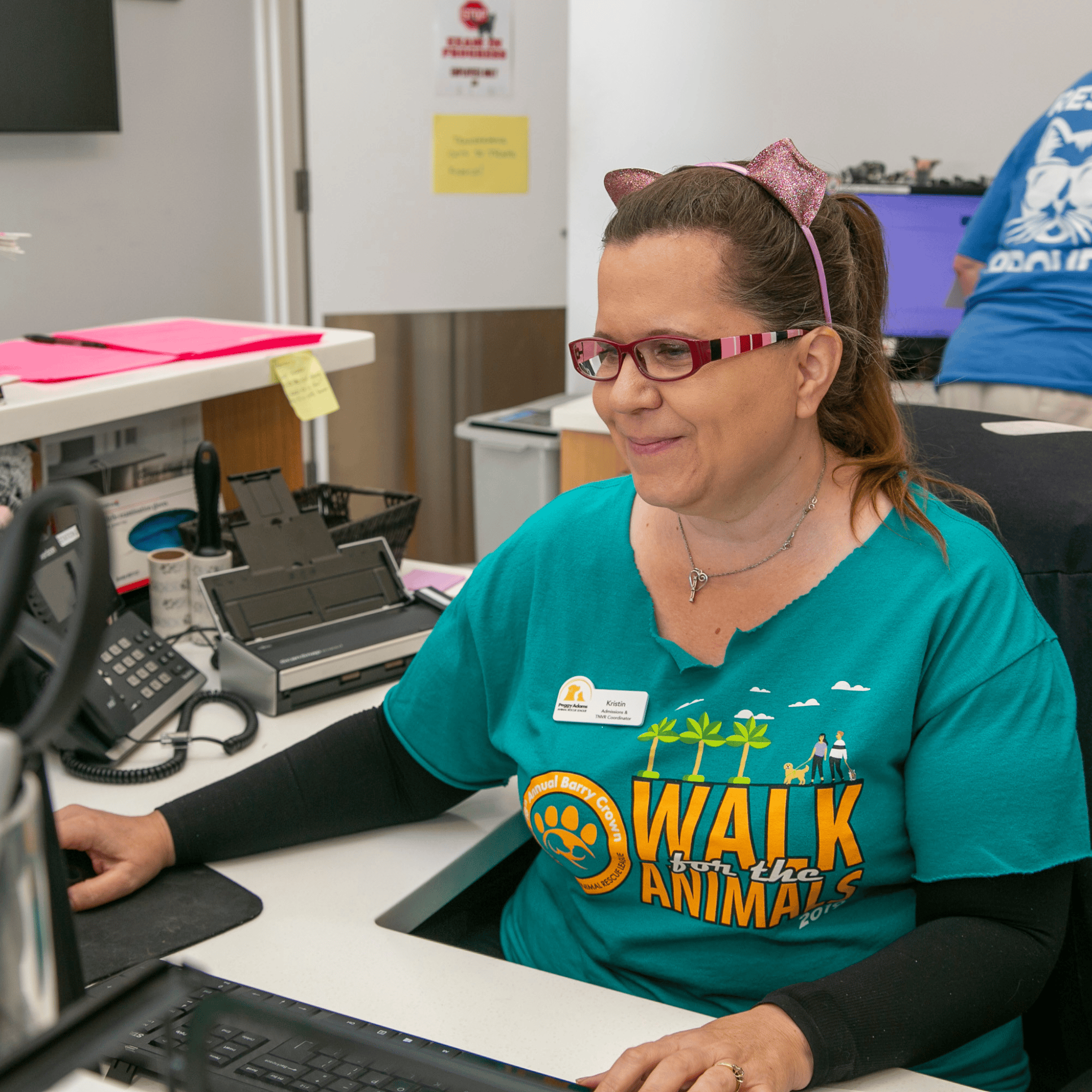 Volunteer assisting with administrative tasks at Peggy Adams Animal Rescue.