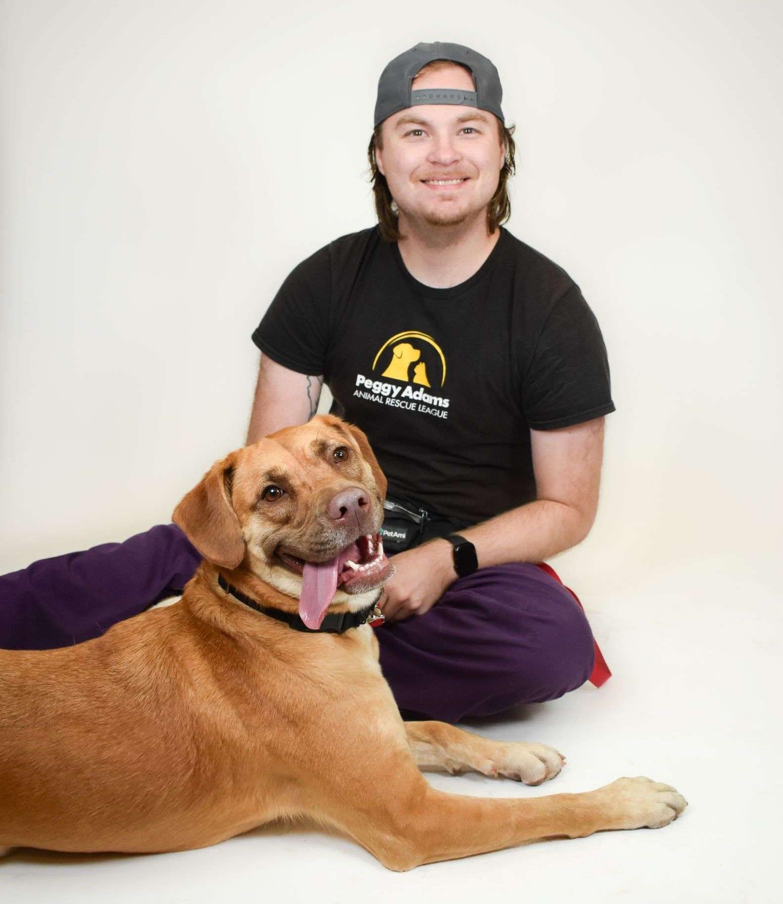 Dog and volunteer at Peggy Adams Animal Rescue League.